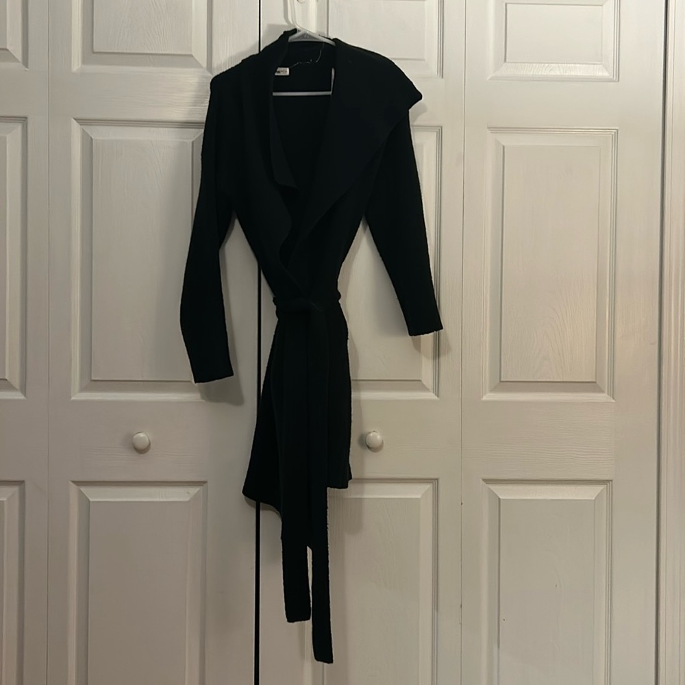 Long black cardigan, has tie at waist.